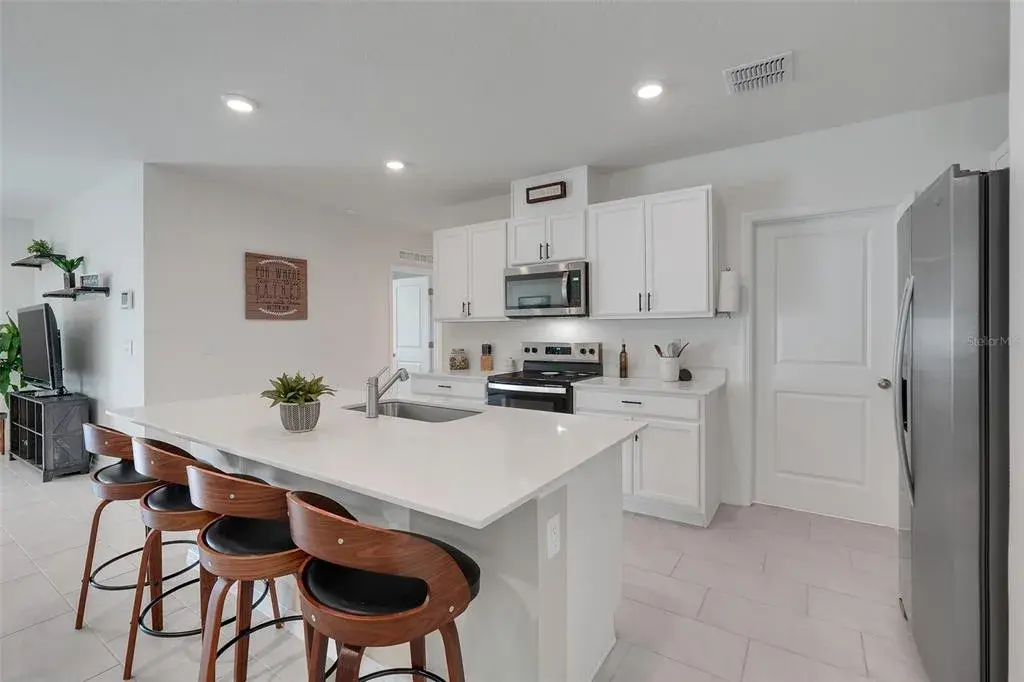 Kitchen has a walk in pantry