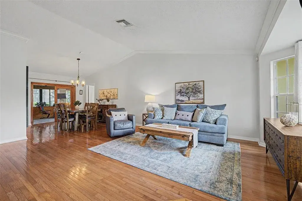 Vaulted ceiling and view of Florida room