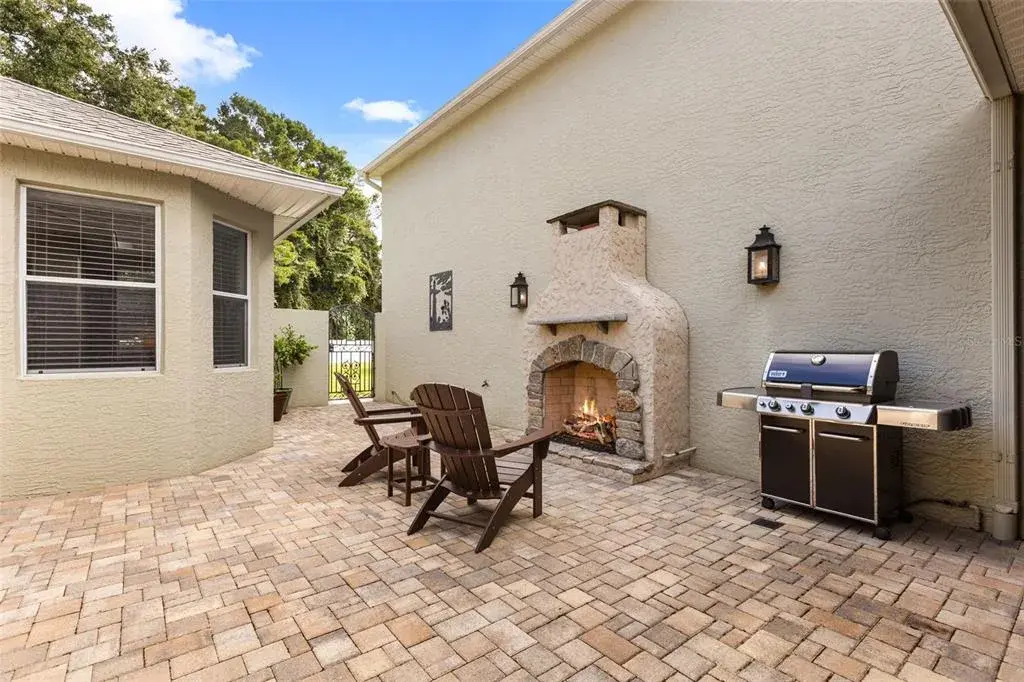 Private Courtyard with Outdoor Gas Fireplace, Paver Patio & 2 Custom Copper Gas Lanterns