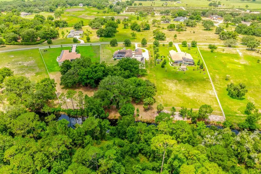 Perfectly situated within a gated, equestrian community.