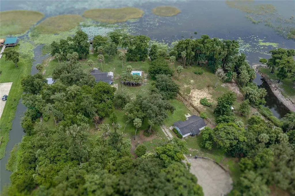 Aerial view of 3 homes, pasture and cul-de-sac