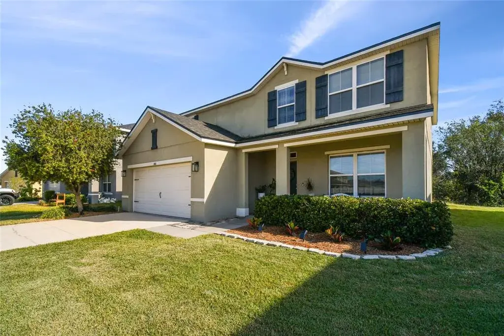 Two car garage and well maintained yard.