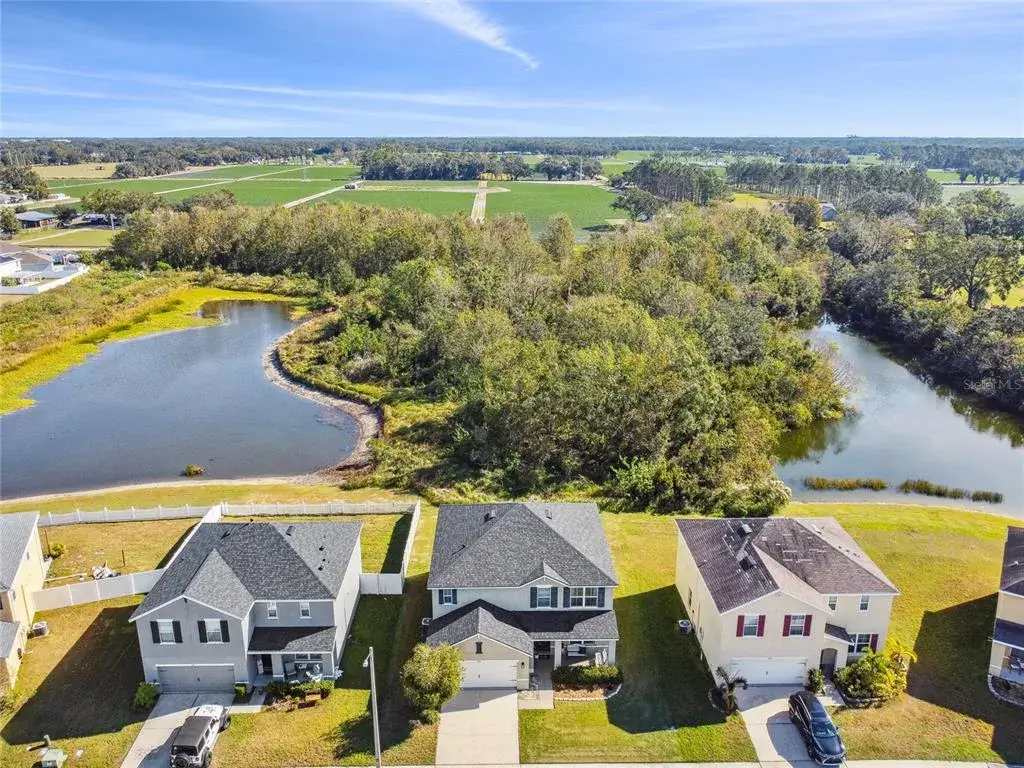 Aerial view of the home.....backyard has adjacent views of the pond as well as access to the pond.