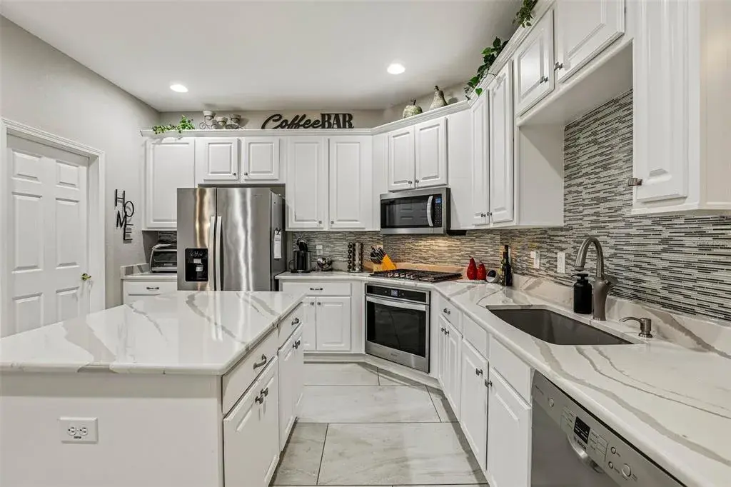 Kitchen with marble counters