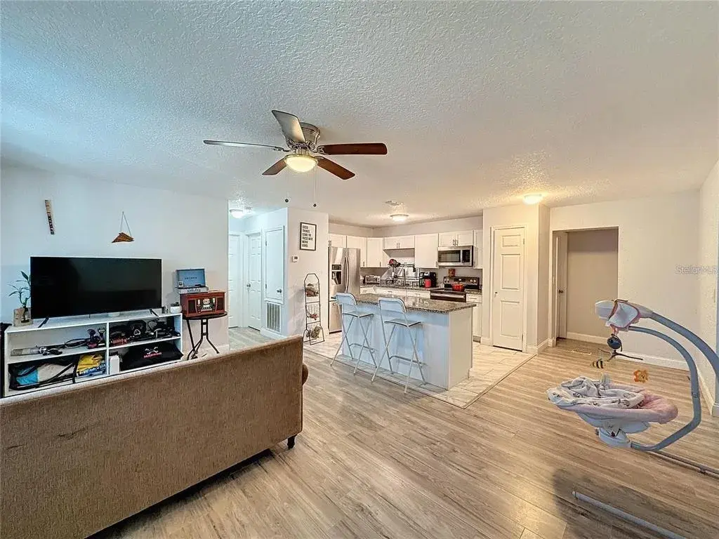 FRONT SIDE ANGLE LIVING ROOM KITCHEN