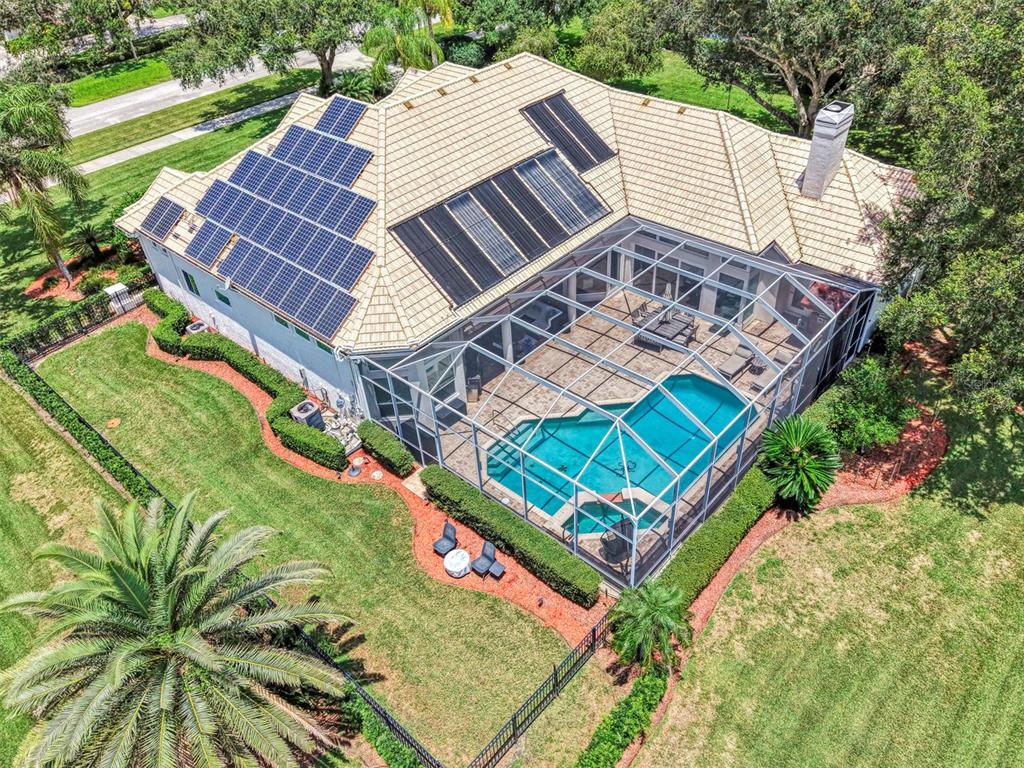 Overhead - fenced dog run, and solar panels power the home, energy stored in Tesla Powerwall