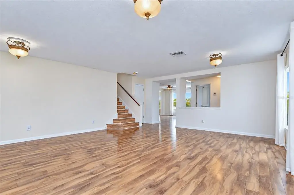 Attractive wood laminate flooring flows throughout the home.