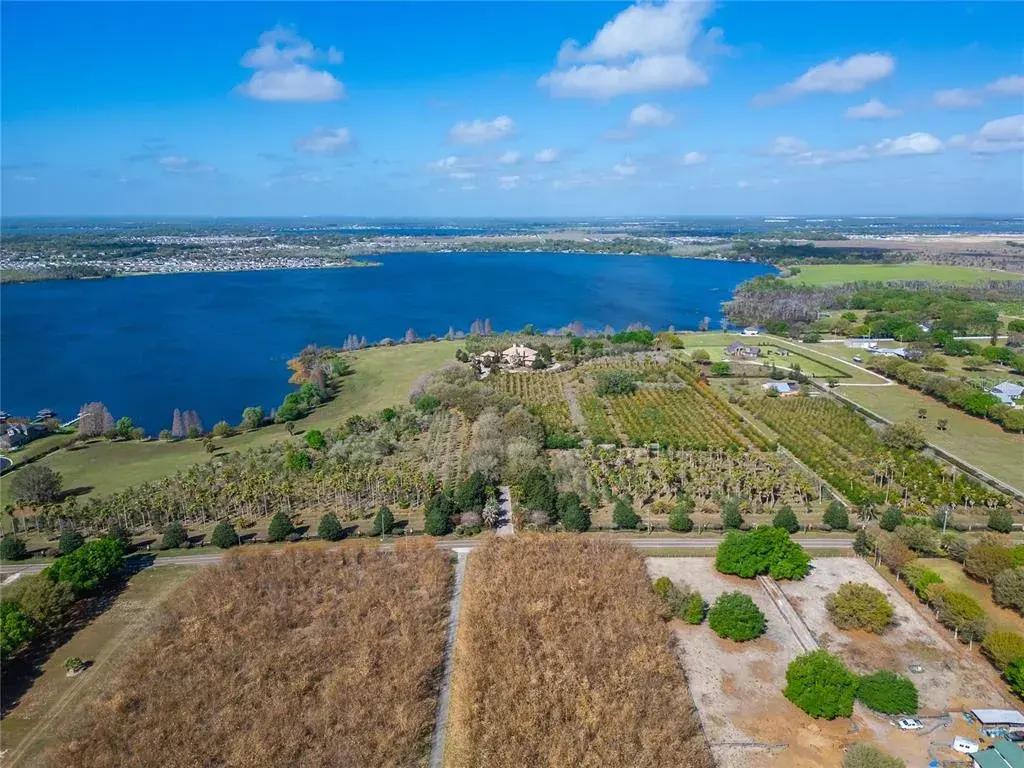 This photo shows all 44 acres of 501 Adams Barn Road.  The parcel to the right with the shed and tennis court is the one for sale.