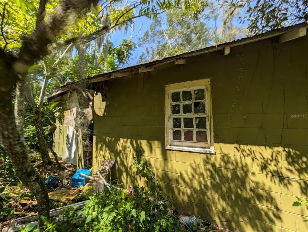 Side of the first house to the right