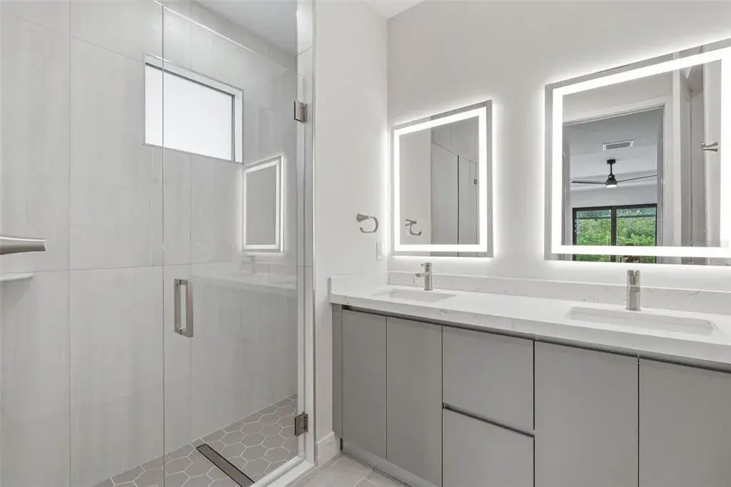 Primary Bathroom with Dual Vanity, LED Mirrors and Walk-In Glass Shower