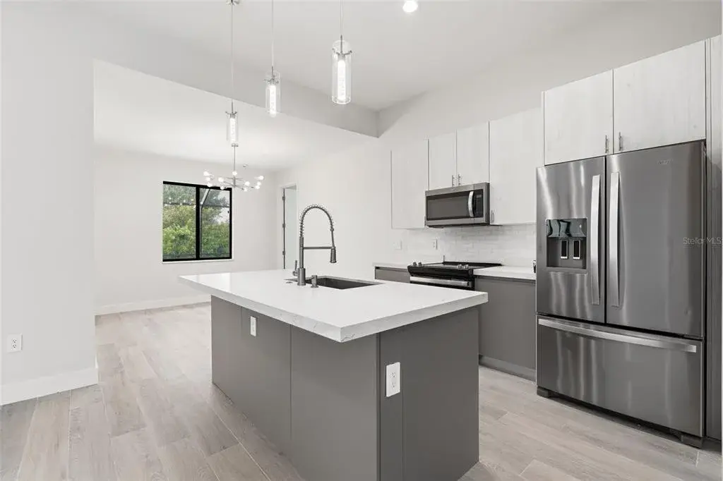 Kitchen Features Quartz Countertops and Stainless Steel Appliances