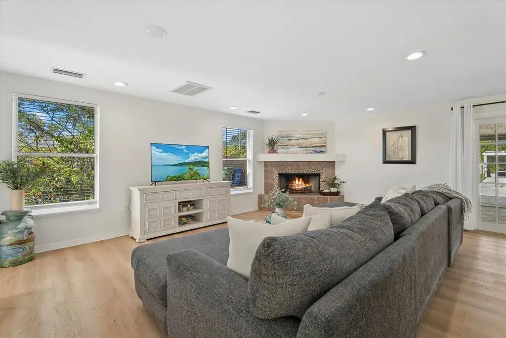 Living Room of Main Home w virtual fire in fireplace.