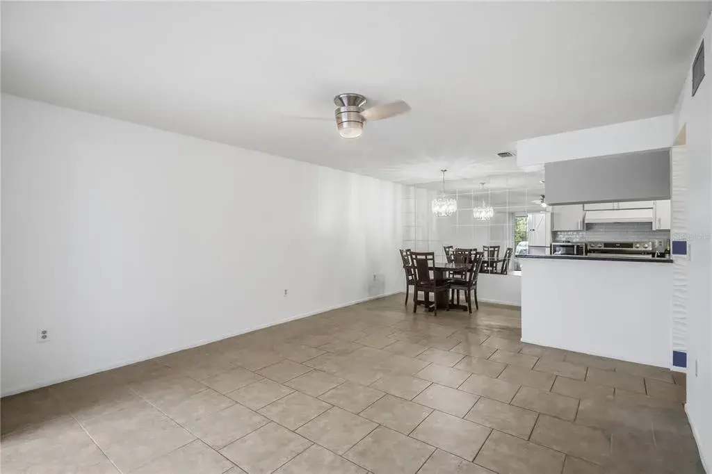 Open living and dining area with kitchen pass through
