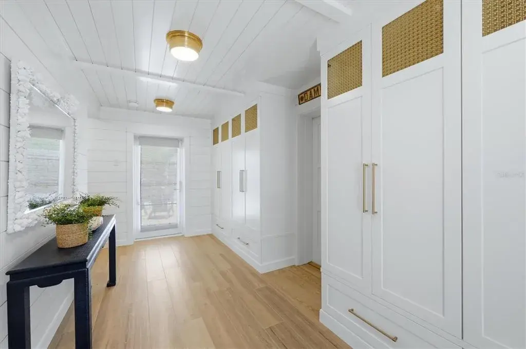 Beautifully designed front entry with custom designed cabinetry