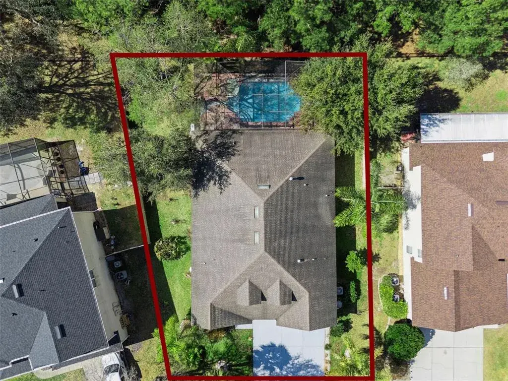 Alternate exterior view showing driveway access and no rear neighbors