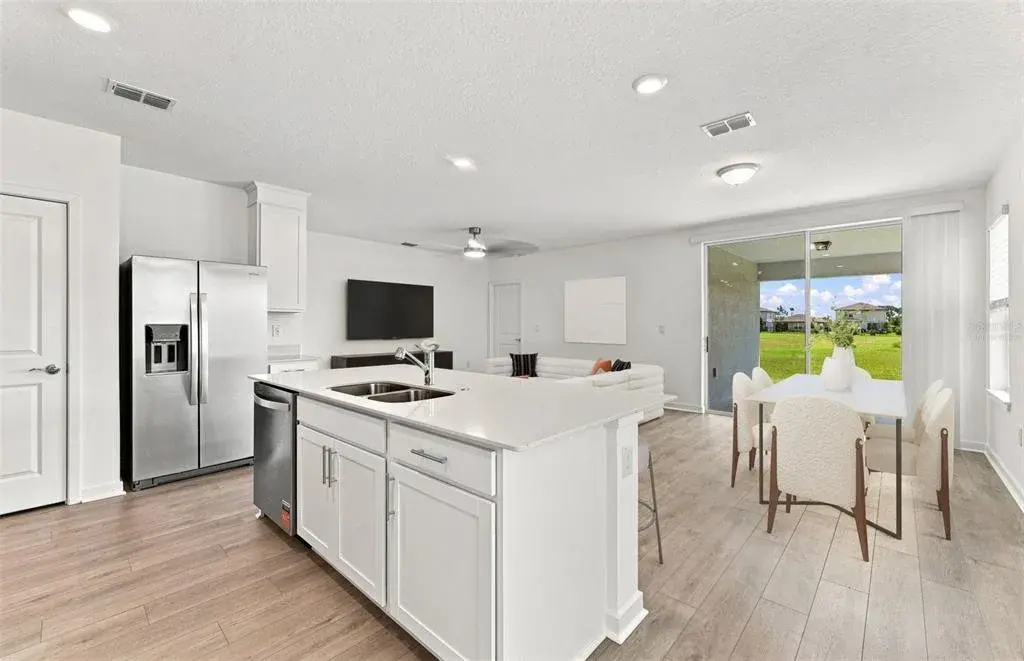Virtually Staged - Open Kitchen to Cafe to Gathering Room