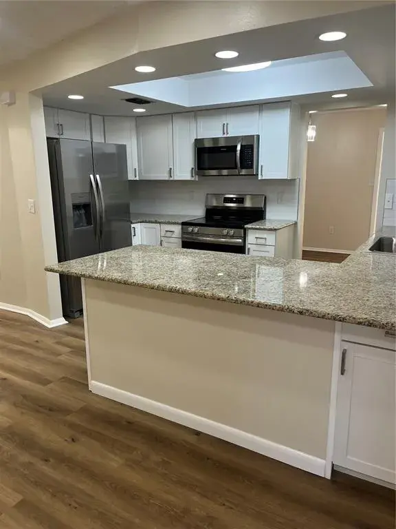 Light and Bright Completely Remodeled Kitchen with snack bar.