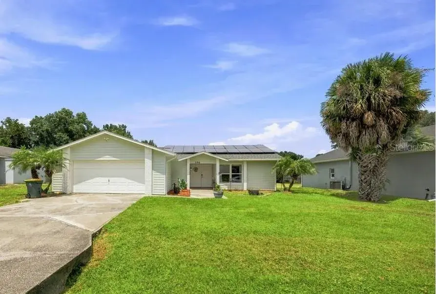 Charming exterior featuring a 2023 roof and low-maintenance landscaping and 2-car garage