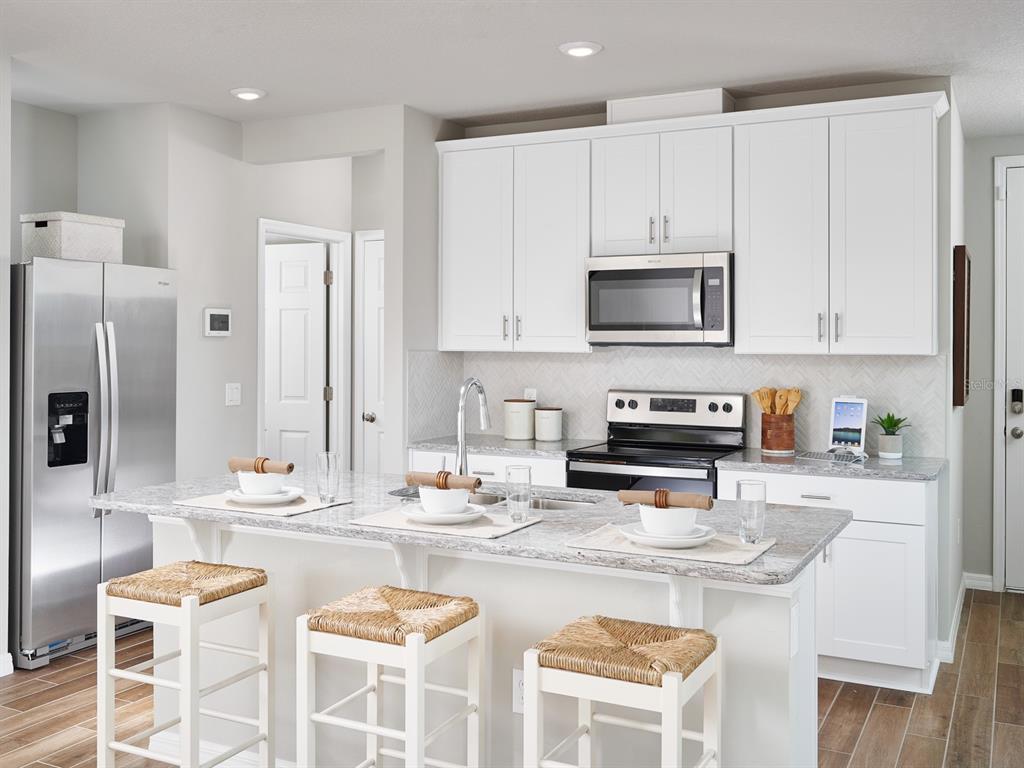 Photo is not of the actual home, but is an inspirational photo of builder’s model home and may depict options, furnishings, and/or decorator features that are not included.