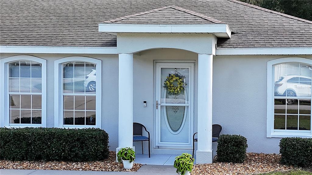 covered entry with storm door...