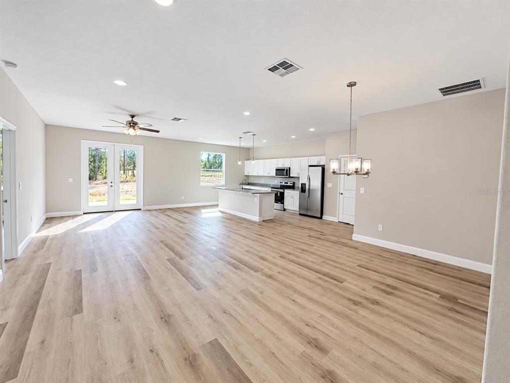 Great room model from front door facing 8' French Doors model