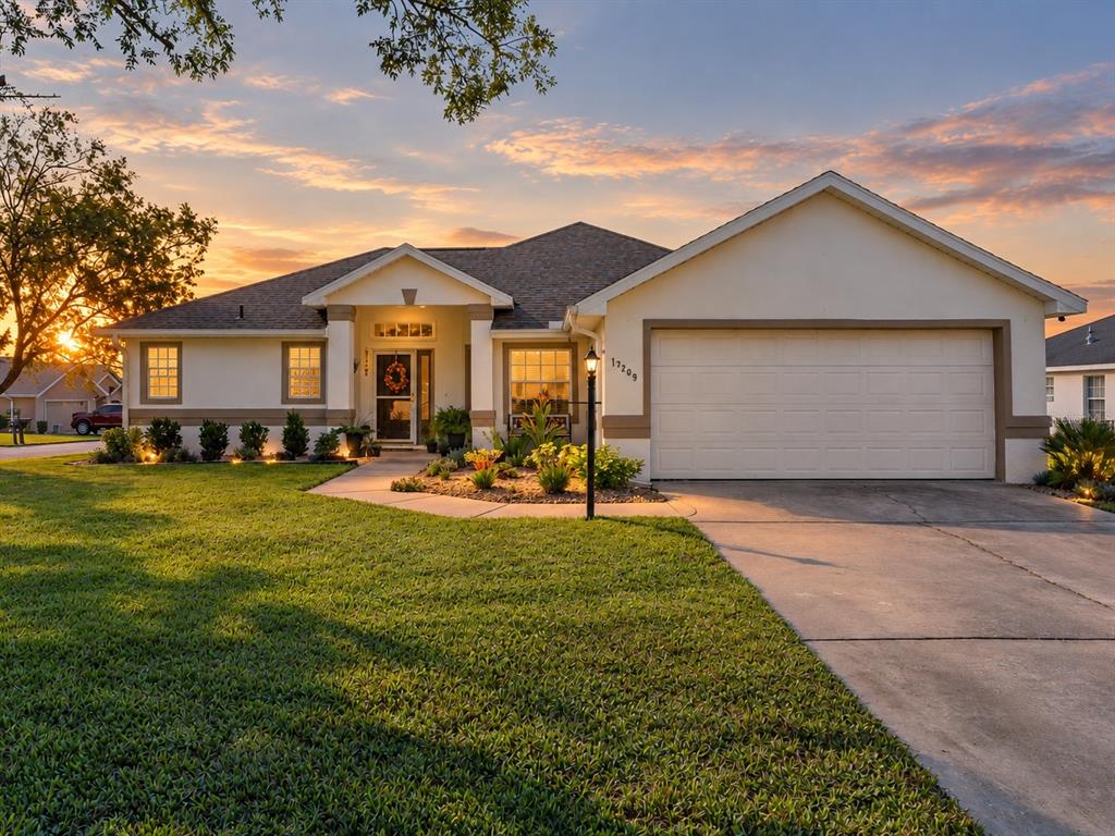 Exterior front of home situation on corner lot and features newer exterior paint and roof.