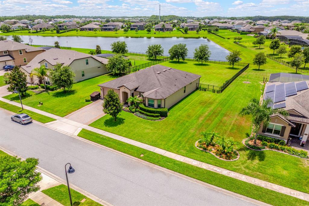 Situated on HALF AN ACRE LOT with tranquil pond views.