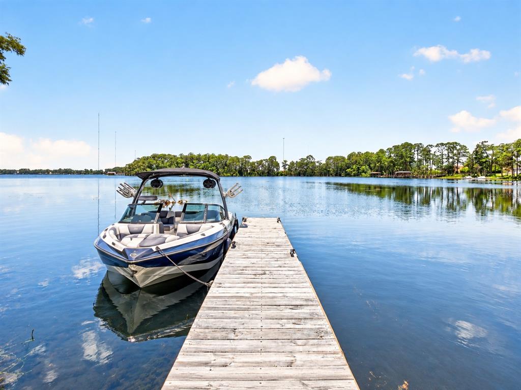 Experience luxury living, PEACEFUL WATERFRONT VIEWS, and access to one of Central Florida's PREMIER SKI LAKES in this exceptional 3-bedroom, 2.5-bath estate home in the GATED COMMUNITY of Estates at Lake Pickett.