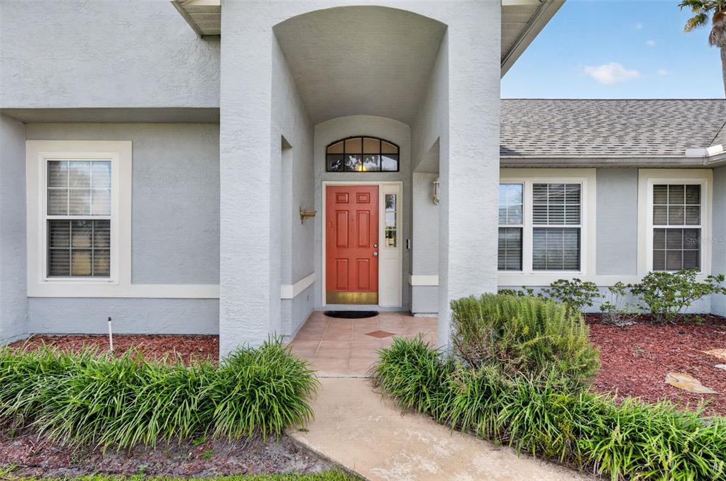 Mature landscaping greets you at all corners of this home.