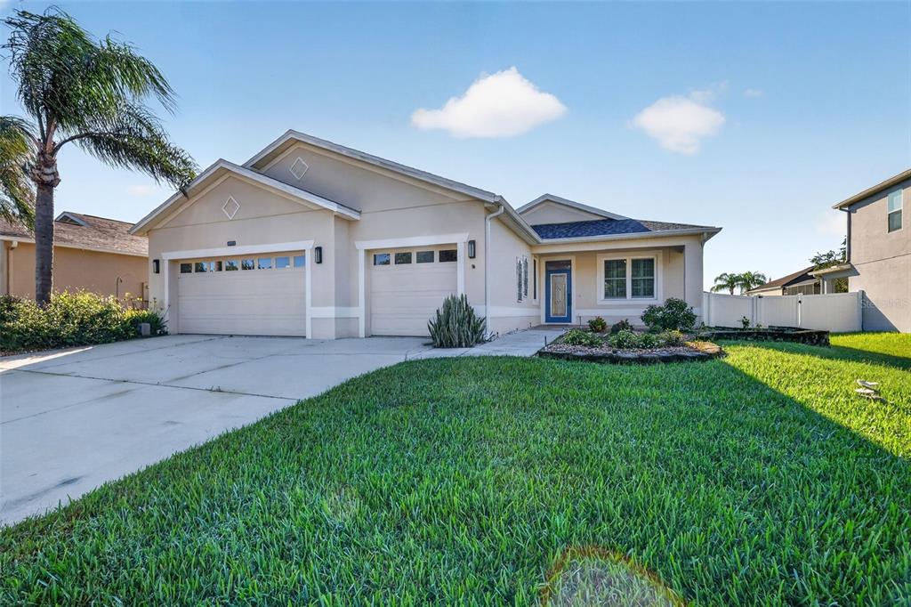 WOW a 3-car garage and lots of parking space in the driveway too!