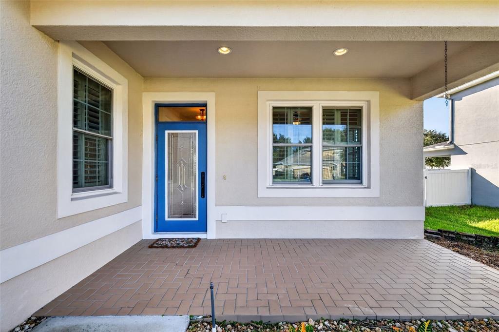 A covered front porch to welcome your guests ~