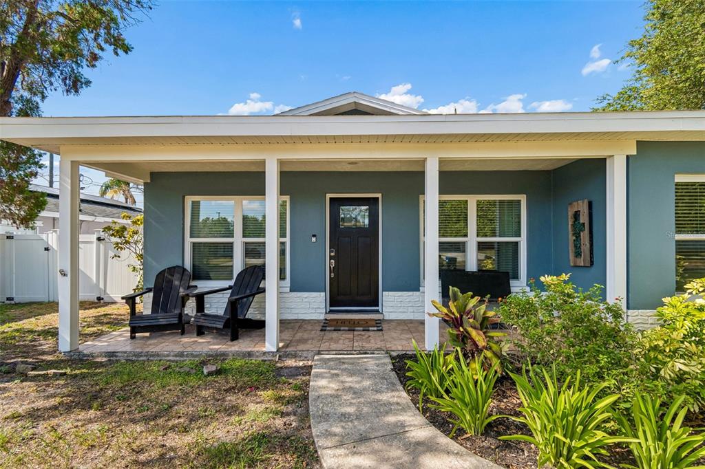 A welcoming covered front porch adds to the charm of this Seminole home.