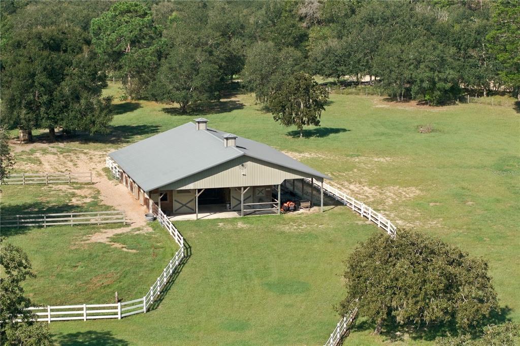 Impressive 6 stall barn with excellent space for horses, equipment and storage