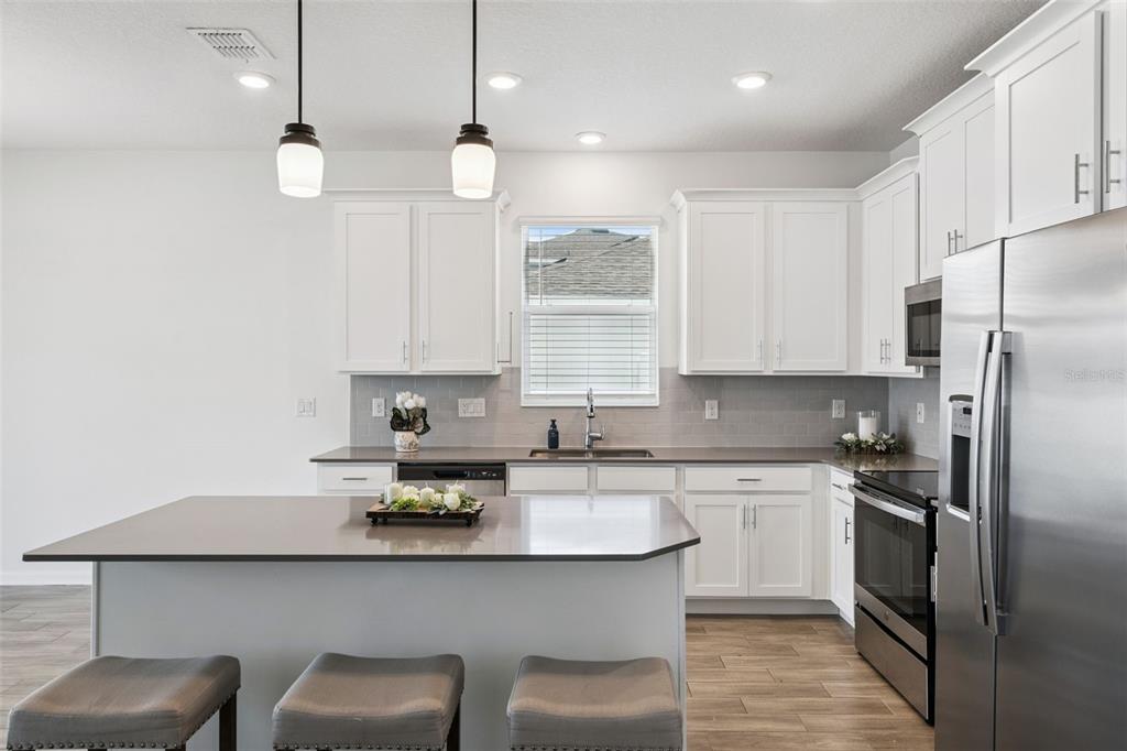 Updated backsplash and lighting fixtures