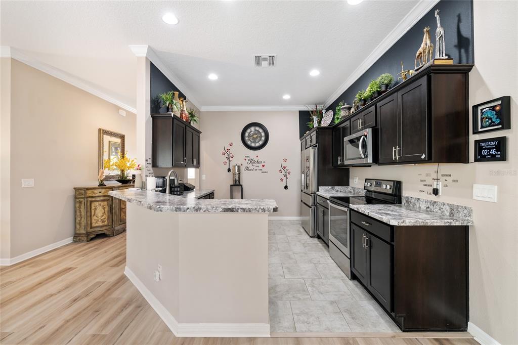Kitchen with bar seating open to the main living area