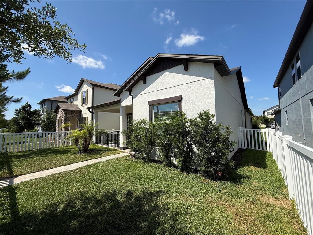 Side of the home with vinyl enclosed fencing