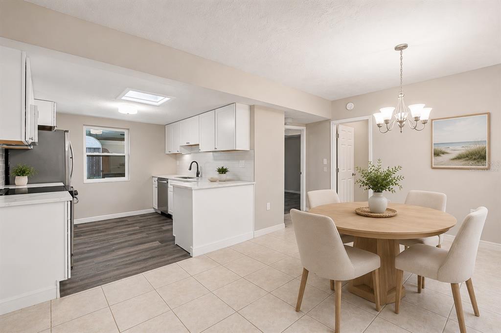 Virtually Staged Open Dining Area Flowing Seamlessly Into Updated Kitchen