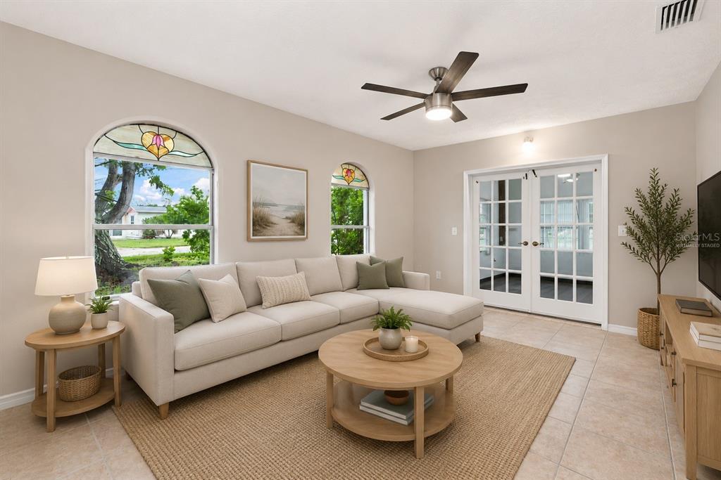 Virtually Staged Living Room with Charming Stained Glass Windows