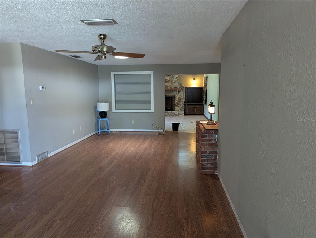 LIVING ROOM WITH OPENING TO FAMILY ROOM