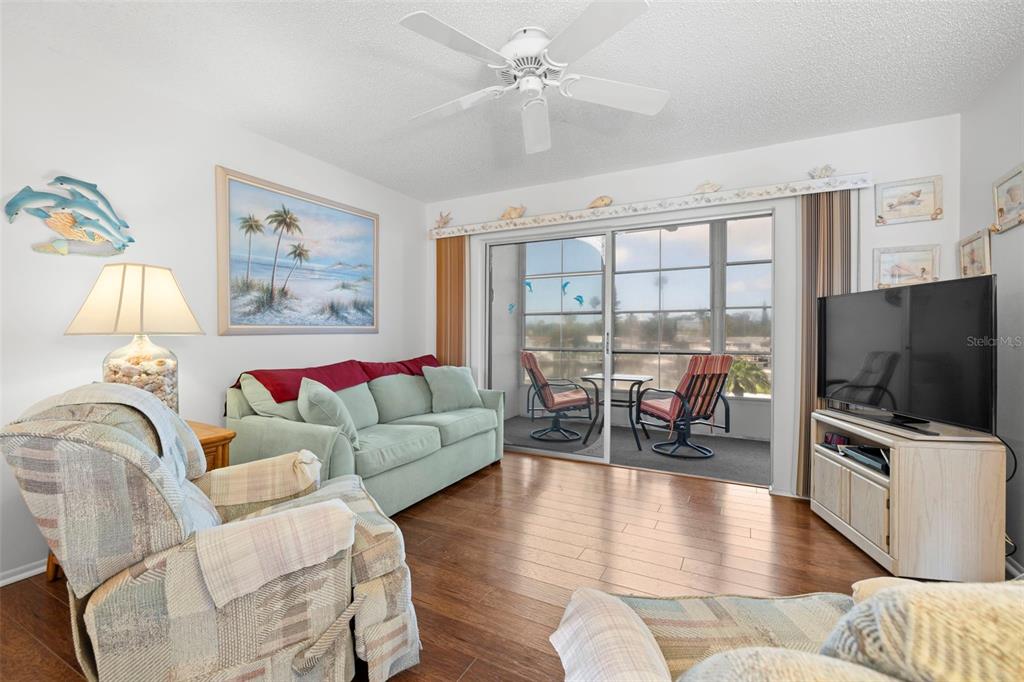 View into the living toward the canal/pool and sunset view!