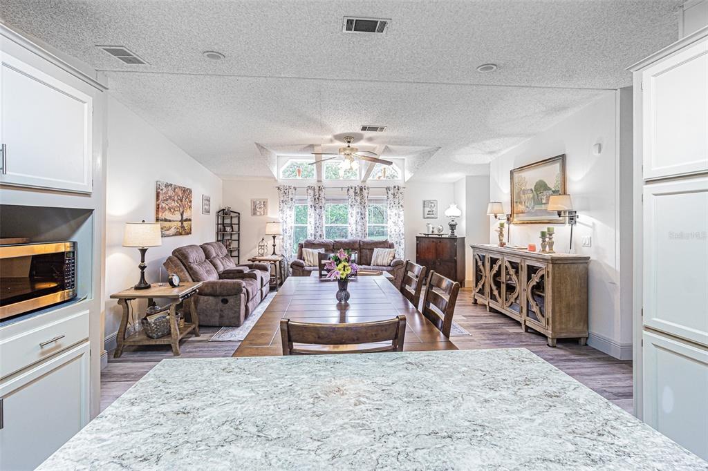 Transom windows add natural light to the Great room which is OPEN to Kitchen!