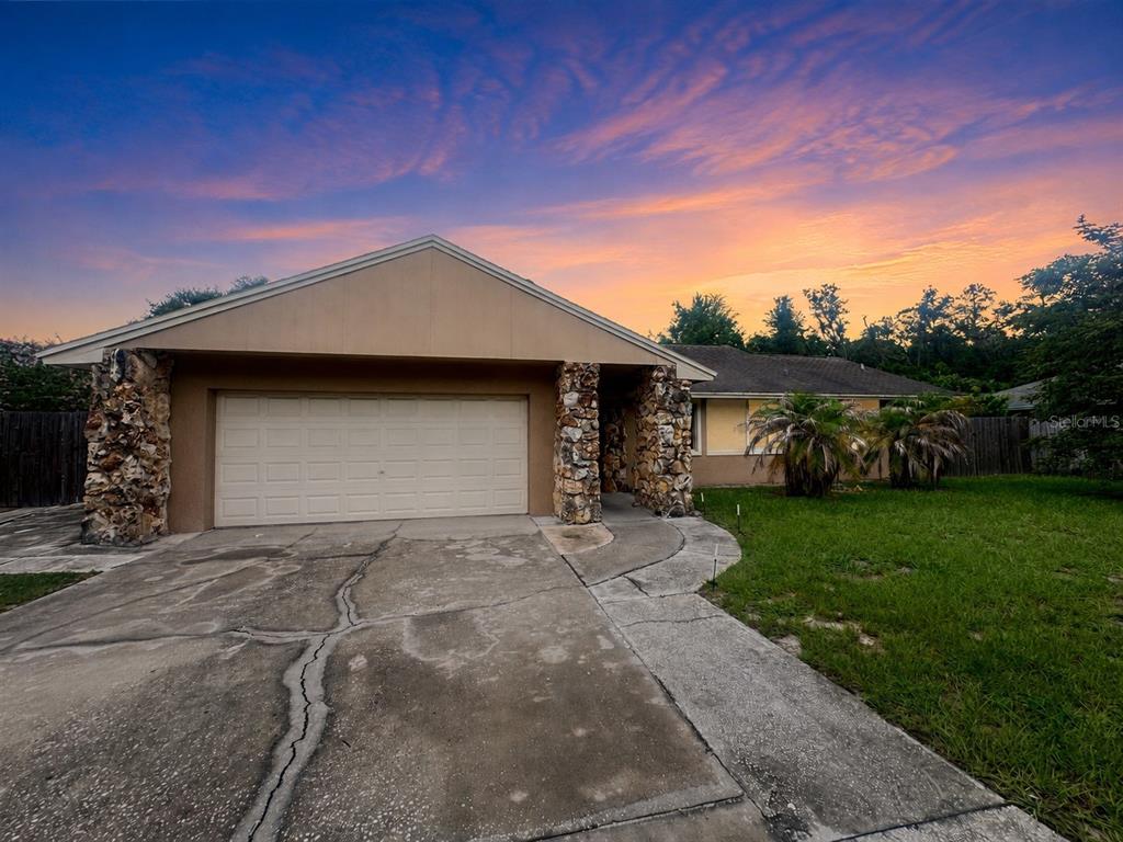 Welcome to 304 Shadow Oak Drive, a spacious single-story pool home with four bedrooms and two bathrooms in Casselberry, Florida