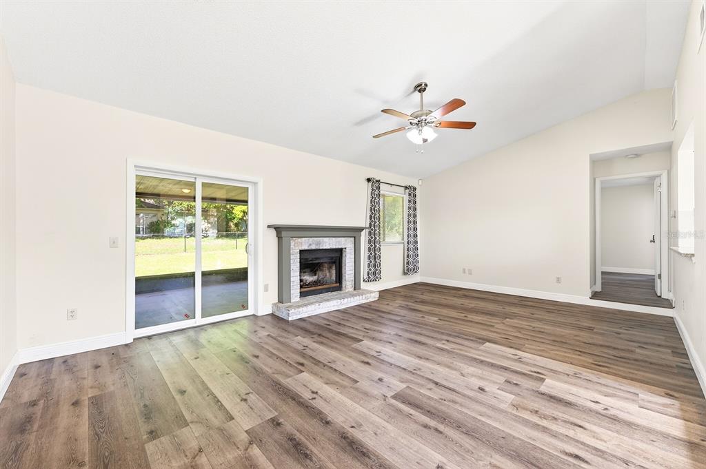 Sliding glass doors lead to the back patio, seamlessly connecting indoor and outdoor living.