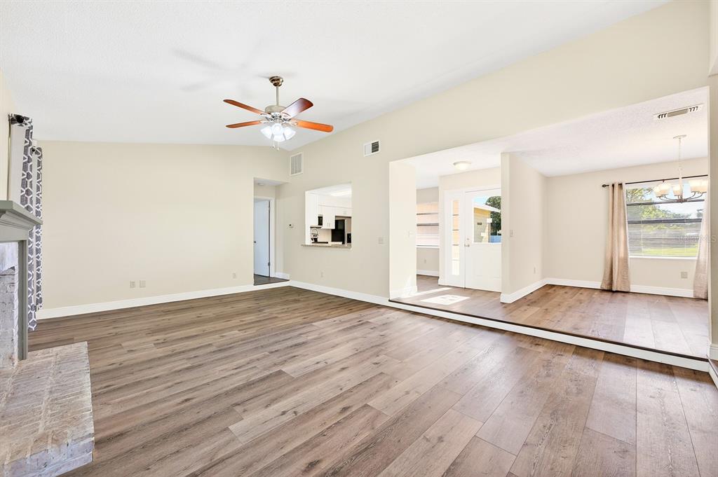 The open-concept floor plan connects the Living Room to the Dining Room and Kitchen.