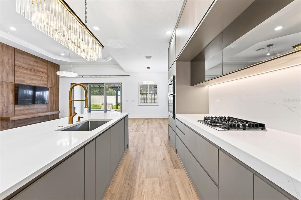 Kitchen is complete with a built-in gas cooktop.
