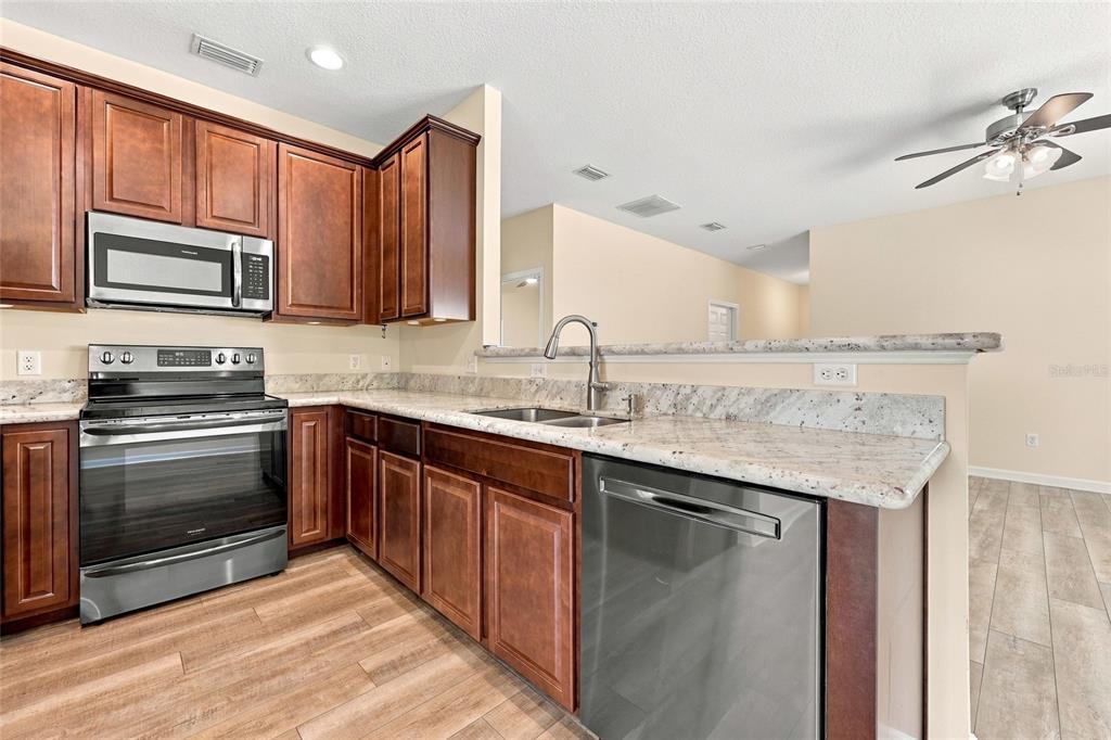 Beautiful Kitchen with Granite counter tops and Stainless Steel Appliances