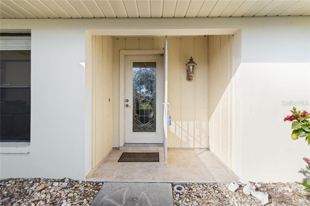 Front porch with screen door to enjoy the crisp evenings Florida sometimes has