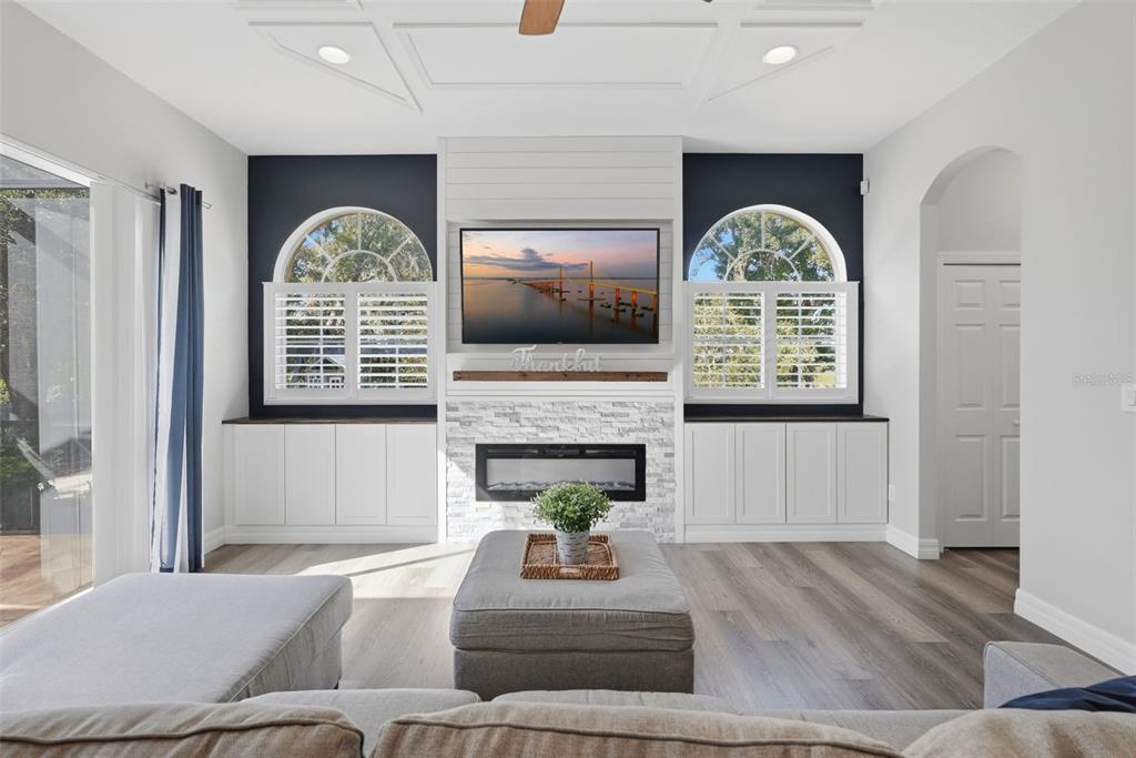 Built in cabinetry, plantation shutters, electric fireplace