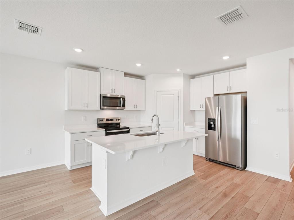 Interior photos are not of the actual home but are photos of the builder home with the same floorplan with similar interior finishes and features.