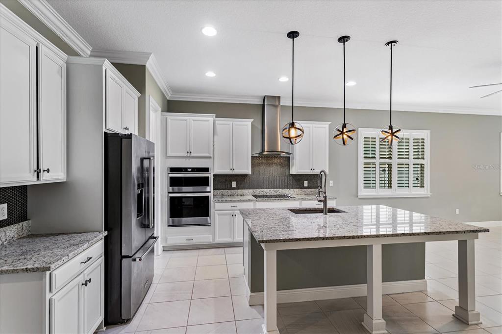 Granite kitchen with large island.